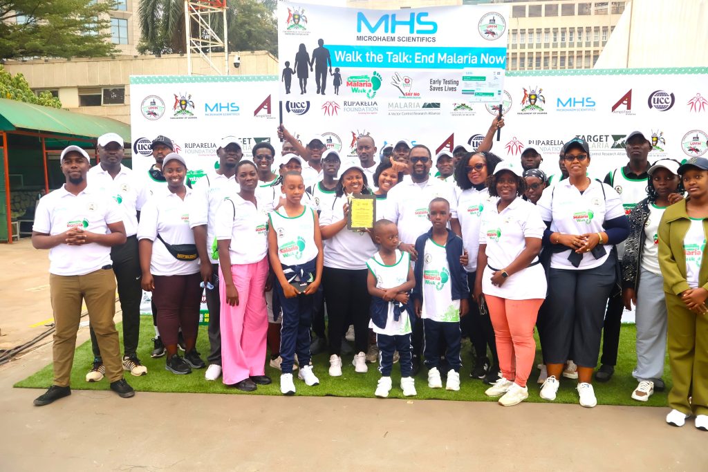 The Microhaem Team posing for a group phot with the Board Chairman after he received the award.